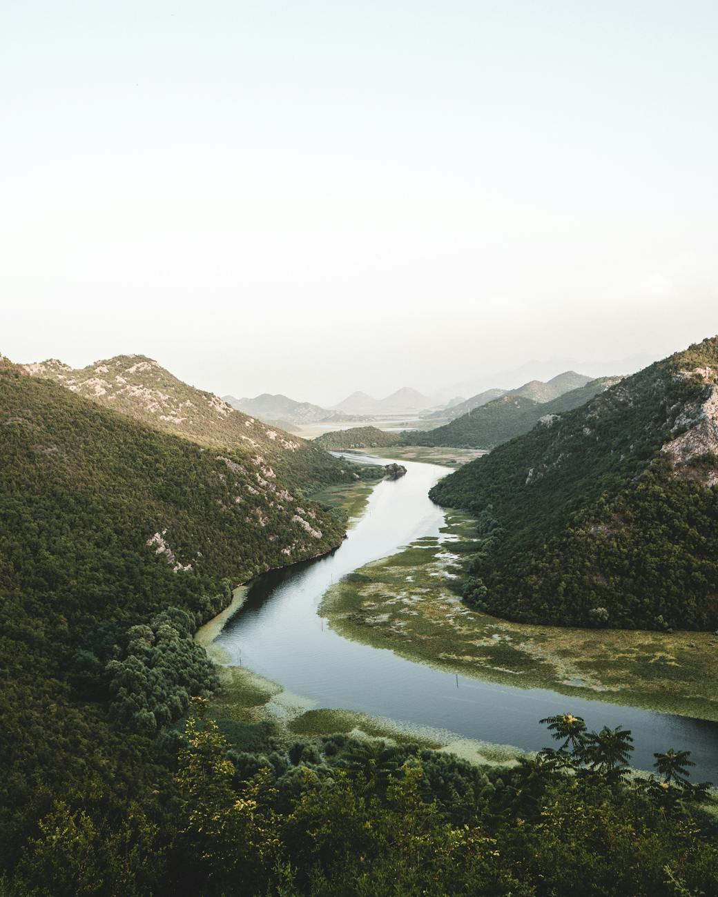 river in between mountains