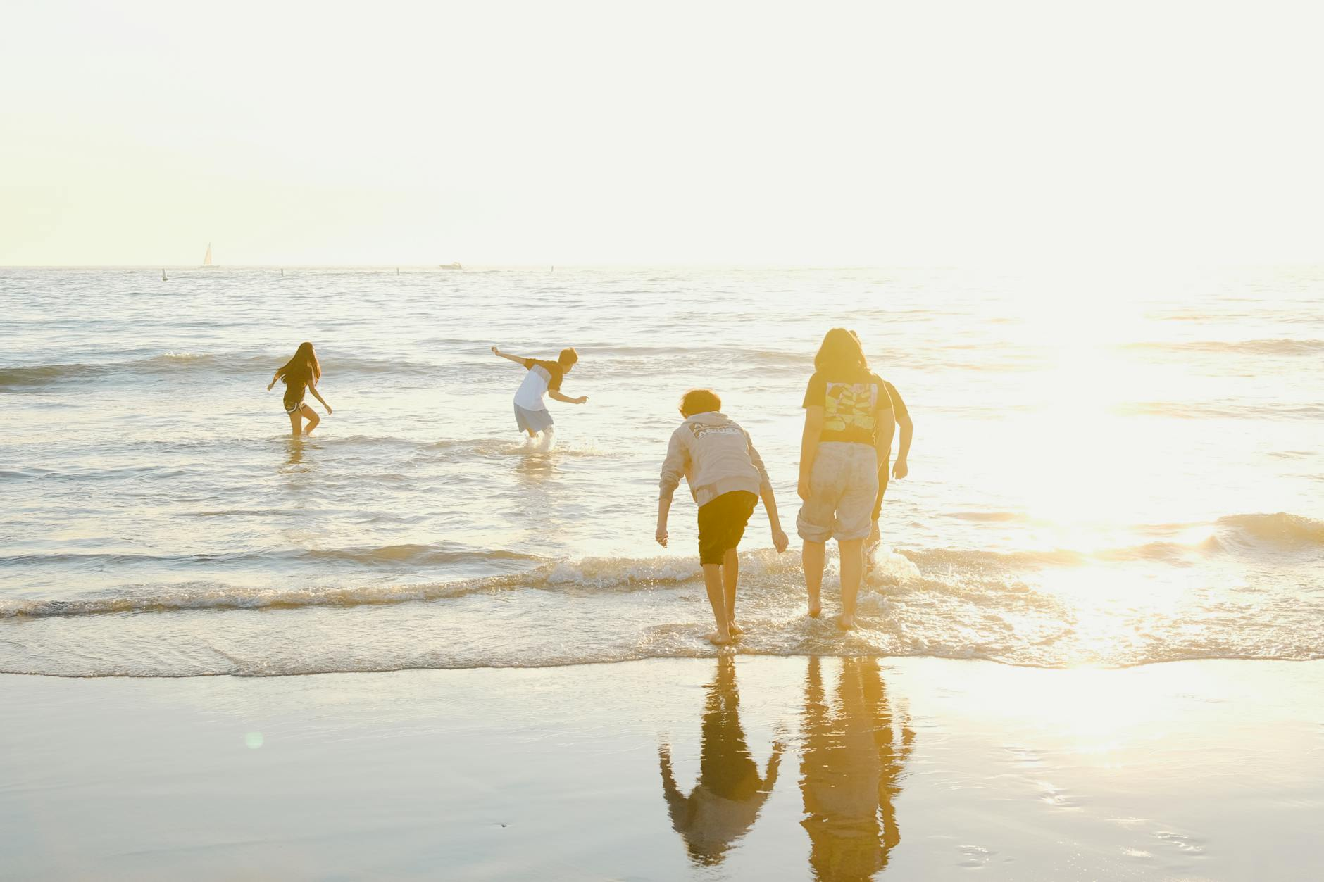 person walking on beach
