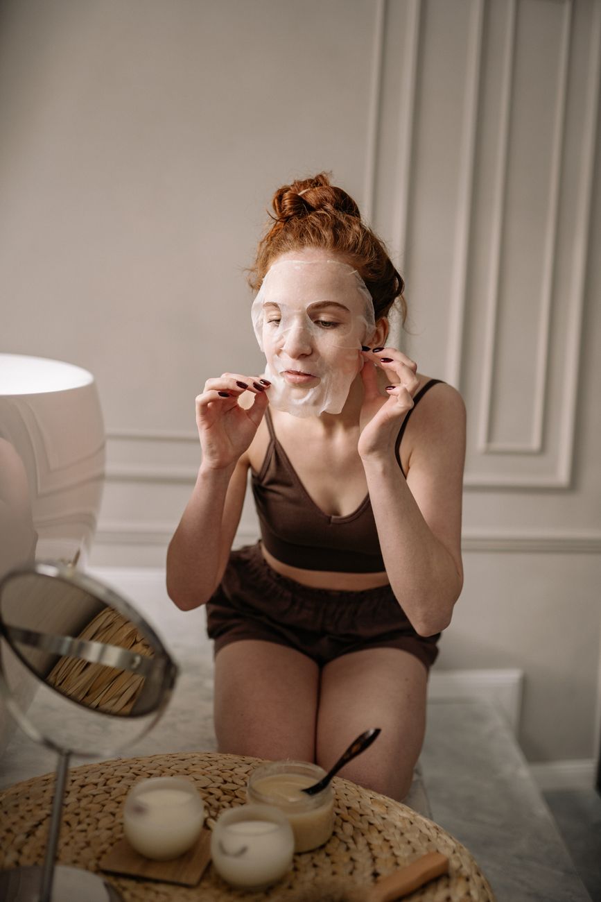 woman applying a face mask